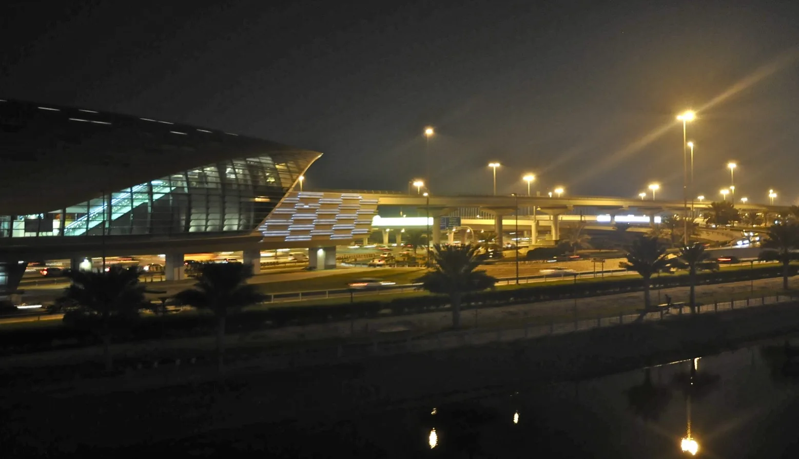 Dubai Metro station at Jumeirah Lake Towers lit up at night